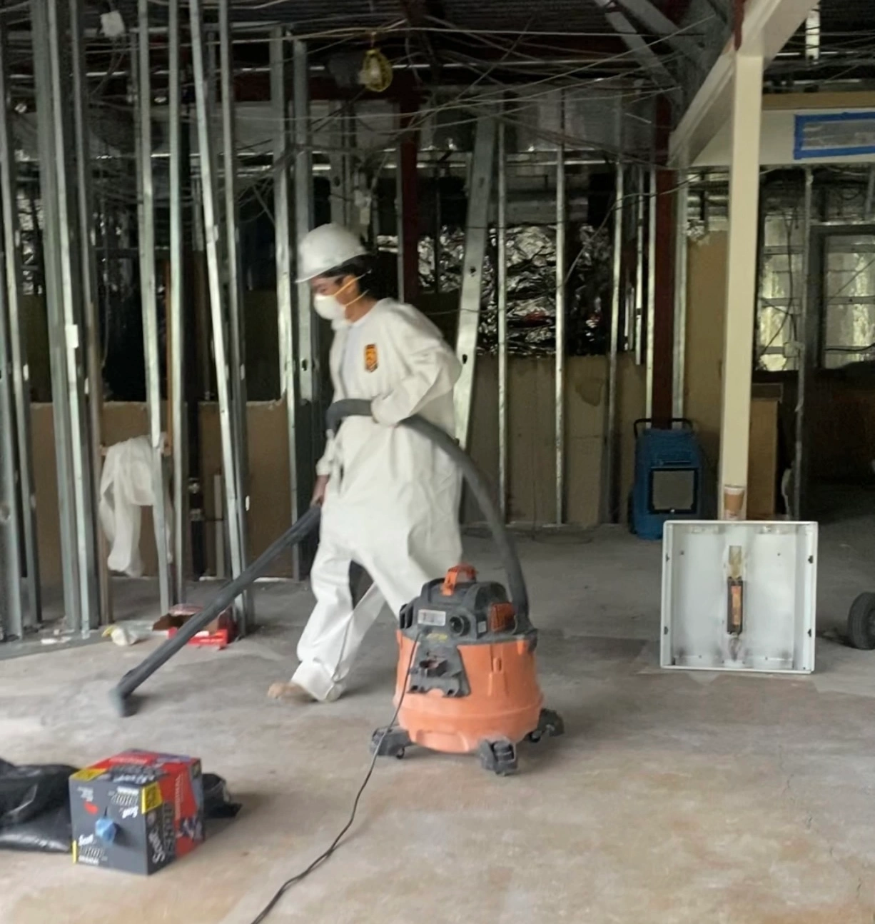 Mold Men NJ Employee Using a HEPA Wet Vac during a Water Damage Restoration Project Mold Men NJ Employee in Sussex County, NJ Using a HEPA Wet Vac during a Water Damage Restoration Project