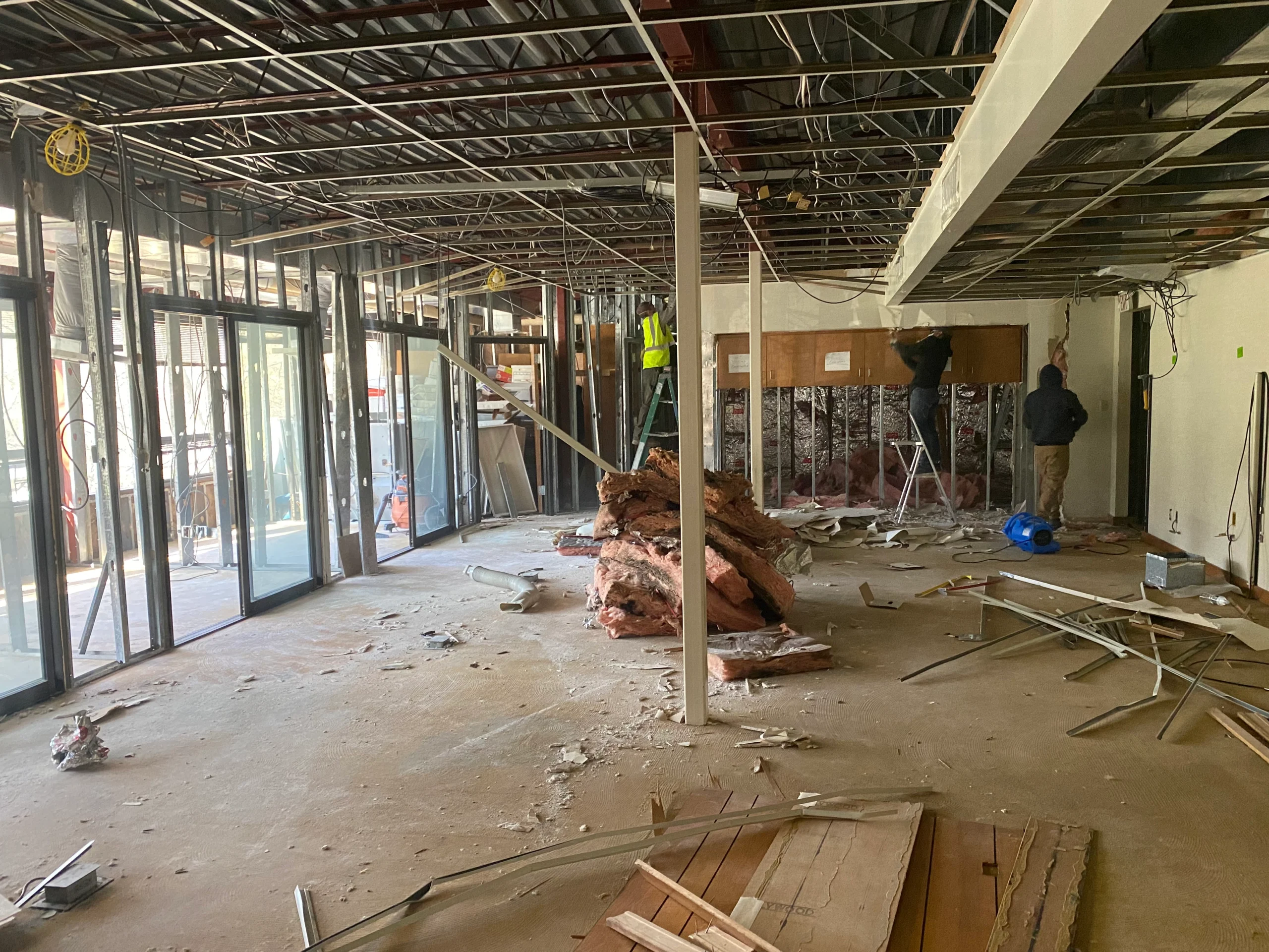 Mold Men NJ Staff Working on Remediating Mold from a Building, the Drywall is ripped out the framing is exposed Mold Men NJ Staff in Mount Olive Township, NJ Working on Remediating Mold from a Building, the Drywall is ripped out the framing is exposed