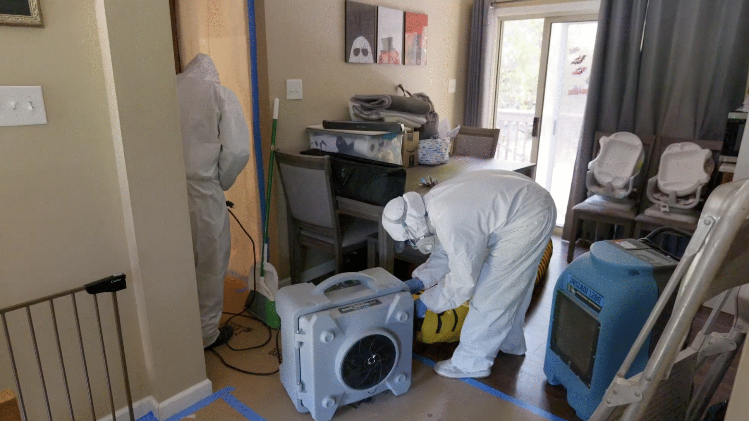 Mold Remediator Setting Up Negative Air Machine - Mold Men NJ Mold Removal Expert in Lopatcong Township, NJ Setting Up Negative Air Machine