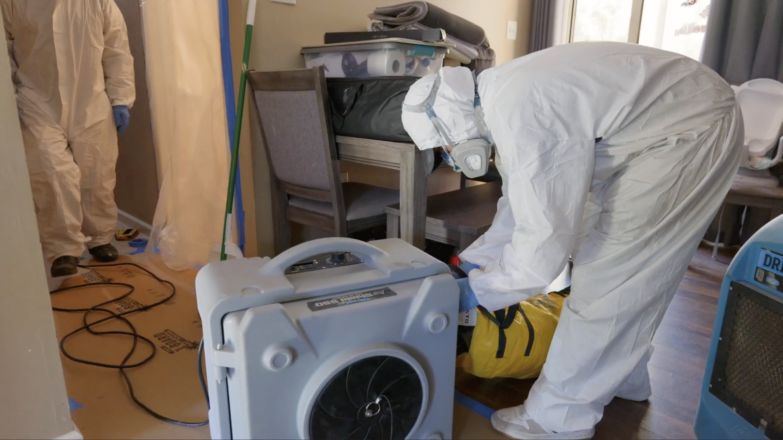 Mold Removal Expert Setting Up Negative Air Machine - Mold Men NJ Mold Removal Expert in Lincoln Park, NJ Setting Up Negative Air Machine