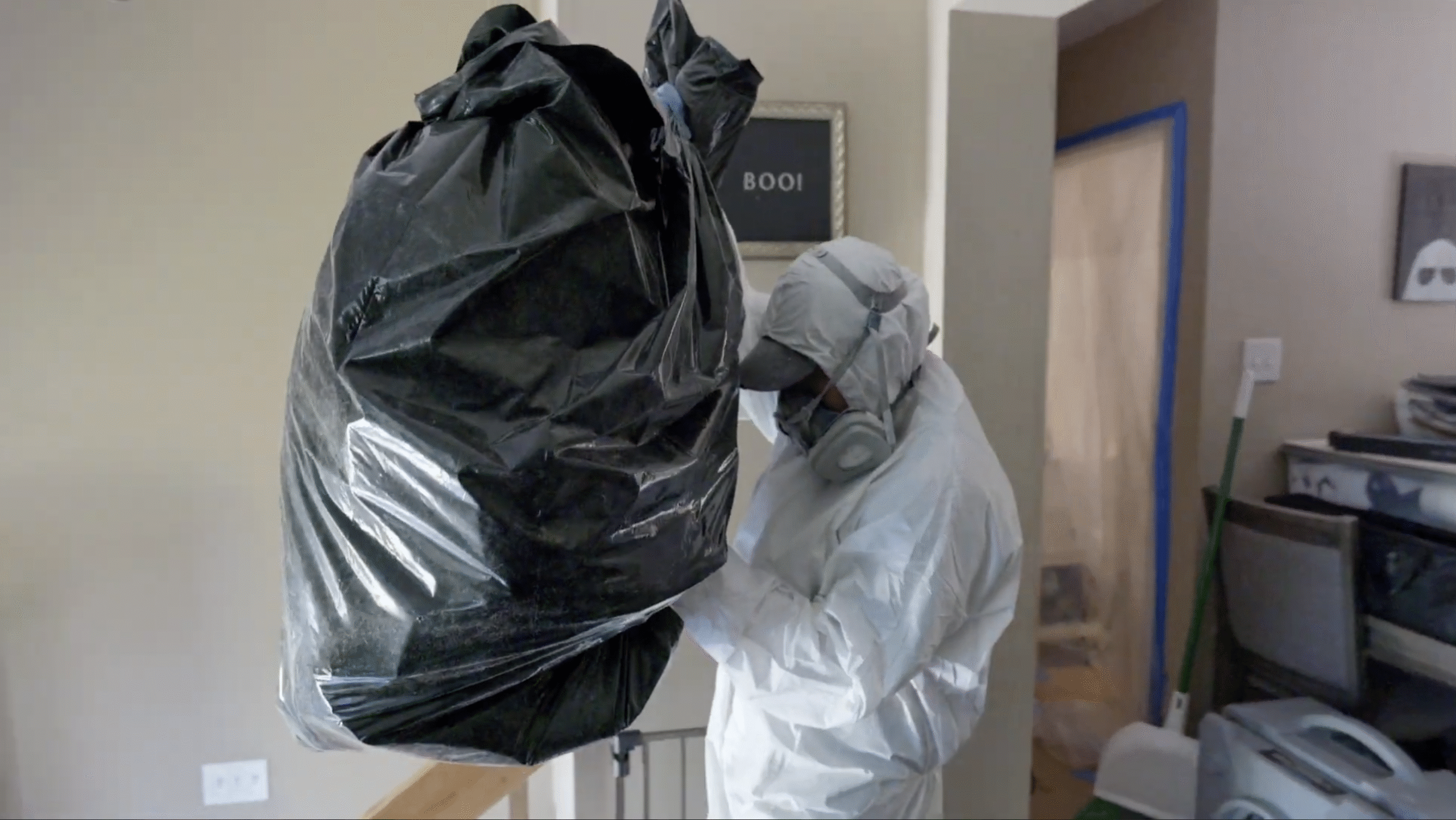 Mold Technician Removing Mold in Trash Bags - Mold Men NJ Mold Technician in Mendham Township, NJ Removing Mold in Trash Bags