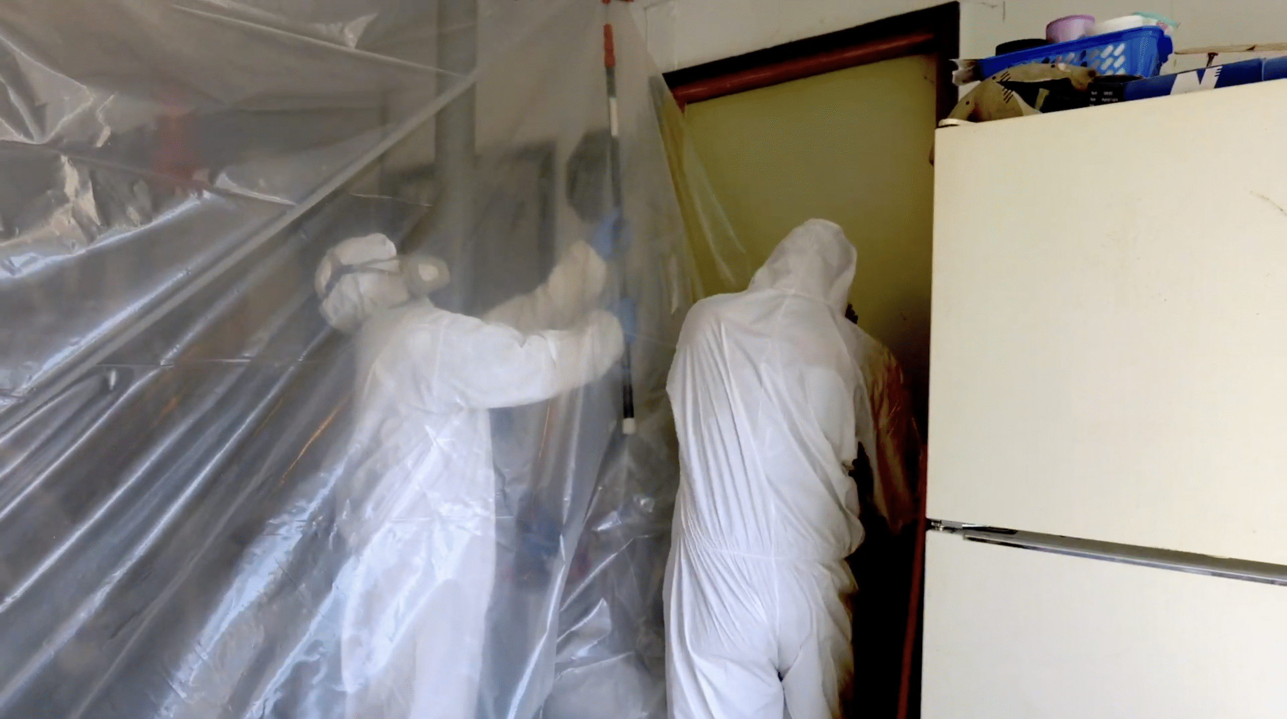 Techs in PPE Setting Up Containment Techs in PPE in Hawthorne, NJ Setting Up Containment